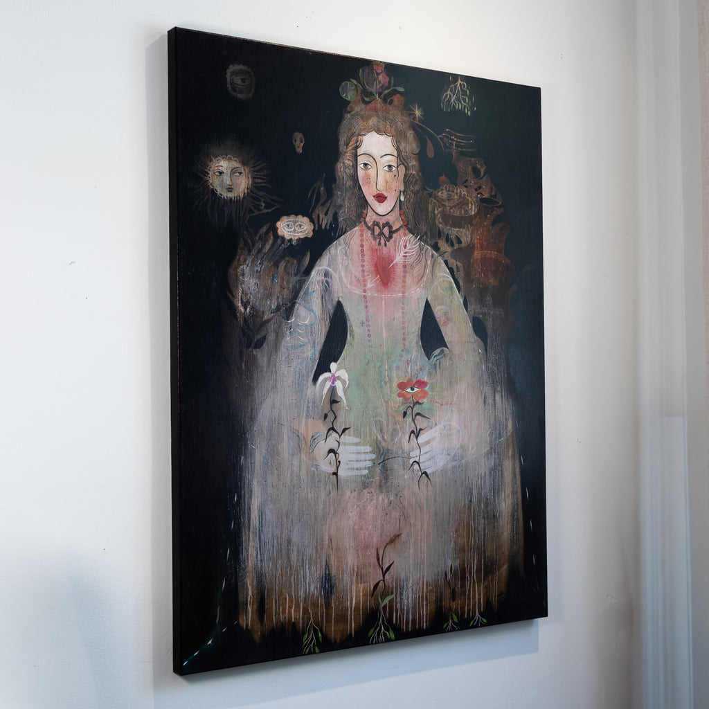 A vertical canvas wall art print featuring a surreal painted portrait of a woman in a pale dress holding flowers, displayed against a plain white wall.