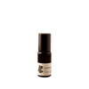 Small black bottle with a white label on a white background