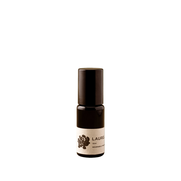 Small brown bottle with a white label on a green background