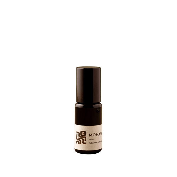 Small brown bottle with a label on a green background