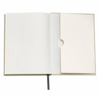 Open notebook with blank pages on a white background