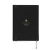 Black notebook with gold logo and text on a white background