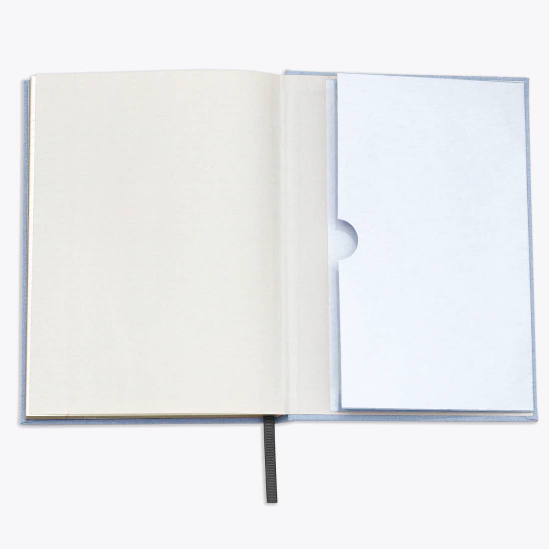 Open notebook with a blank page on a white background