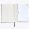 Open notebook with a blank page on a white background