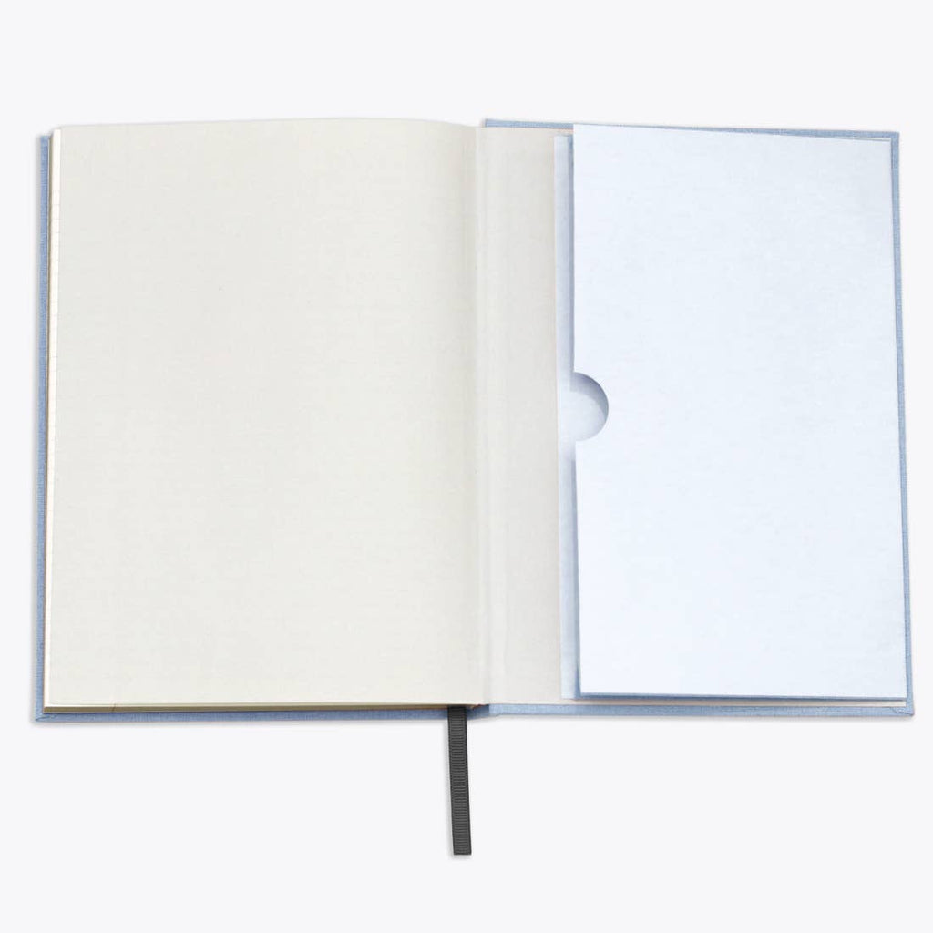 Open notebook with a blank page on a white background