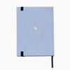 Light blue notebook with a black strap on a white background