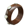 Wooden bracelet with silver accents on a white background