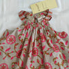 Floral dress with pink and red flowers on a white background