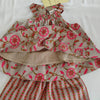 Floral and striped dress with a tag on a white background