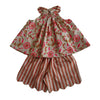 A two-piece children's outfit featuring a sleeveless top with a pink floral print on a beige background and matching striped shorts with scalloped edges.